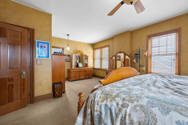 bedroom featuring carpet, baseboards, and ceiling fan