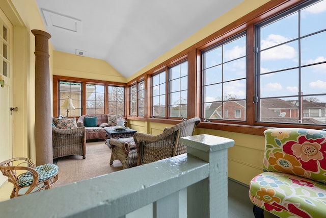 sunroom / solarium featuring vaulted ceiling