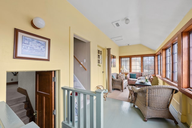 sunroom featuring vaulted ceiling and visible vents