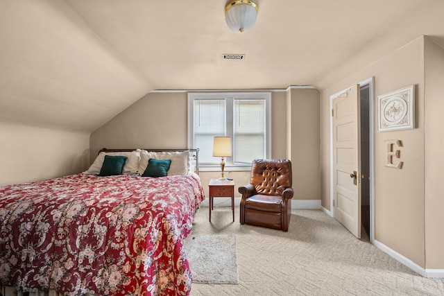 bedroom featuring lofted ceiling, carpet, visible vents, and baseboards