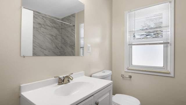 full bath with toilet, walk in shower, a wealth of natural light, and vanity