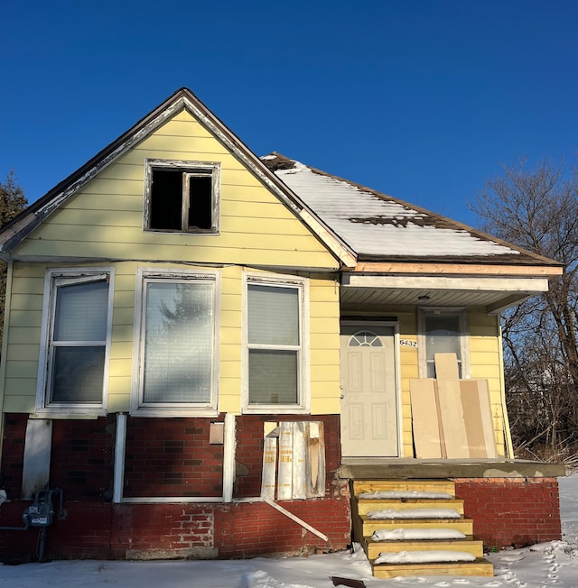 view of front of home with brick siding