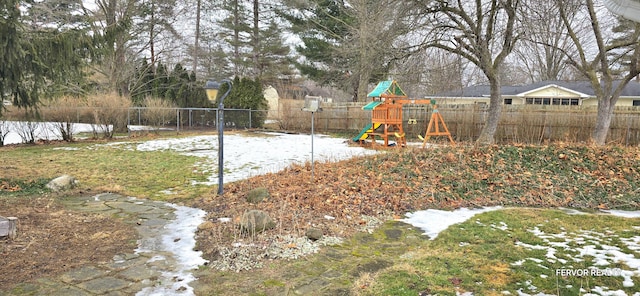 view of yard featuring a fenced backyard and a playground