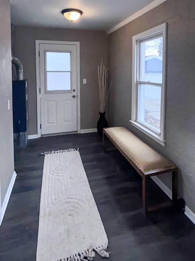 entryway with dark wood-style flooring and baseboards