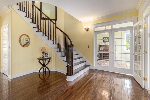 entryway featuring ornamental molding, french doors, stairway, and hardwood / wood-style floors