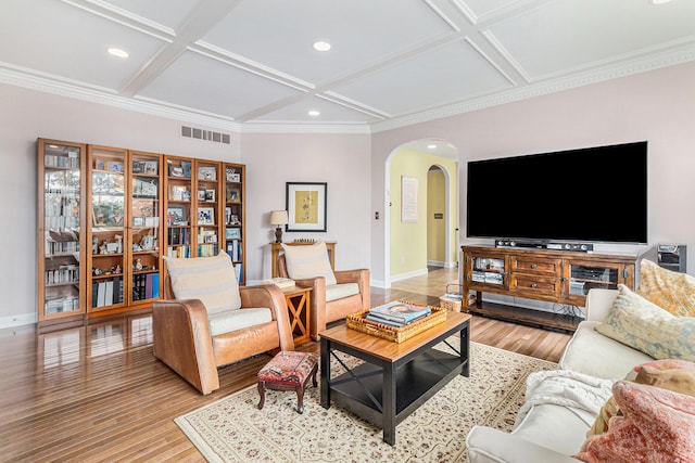 living room with arched walkways, coffered ceiling, wood finished floors, and baseboards