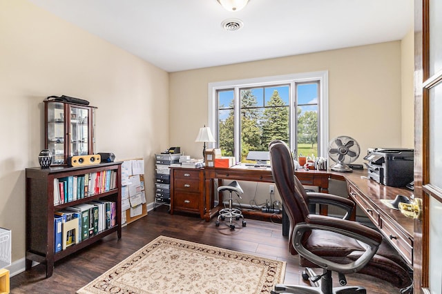 home office featuring dark wood-style floors, visible vents, and baseboards