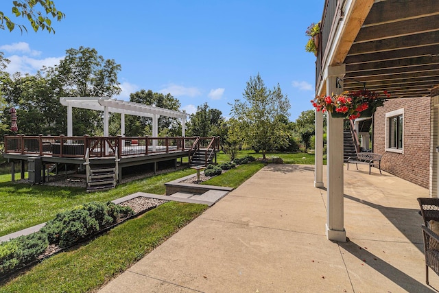 view of patio featuring stairs, a deck, and a pergola