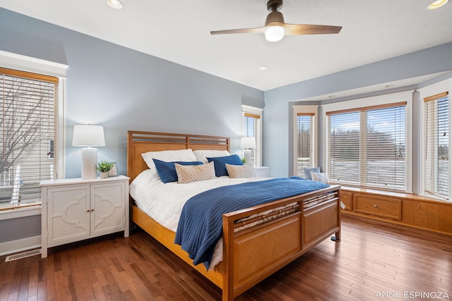 bedroom featuring a ceiling fan, recessed lighting, visible vents, and dark wood finished floors