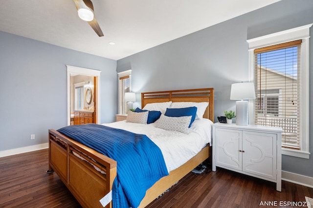 bedroom featuring ceiling fan, baseboards, dark wood-style flooring, and ensuite bathroom