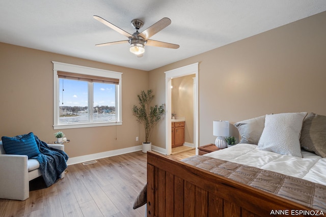 bedroom featuring ceiling fan, connected bathroom, visible vents, baseboards, and light wood-style floors