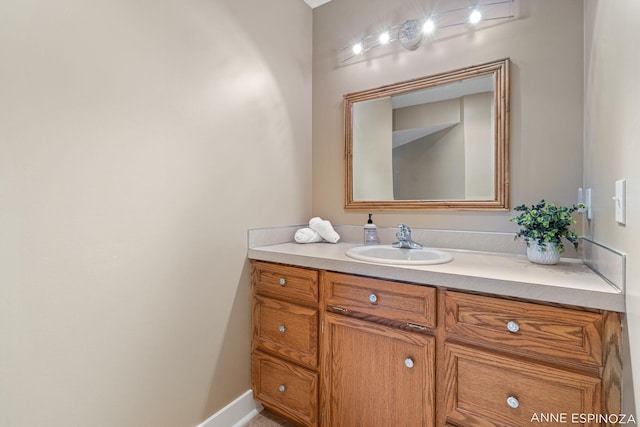 bathroom featuring baseboards and vanity