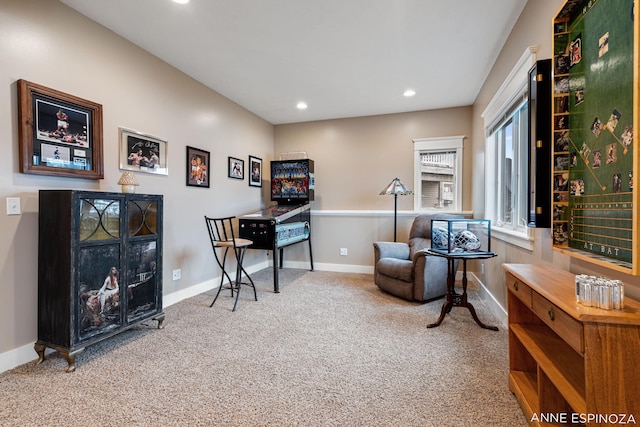 living area with baseboards, carpet, and recessed lighting