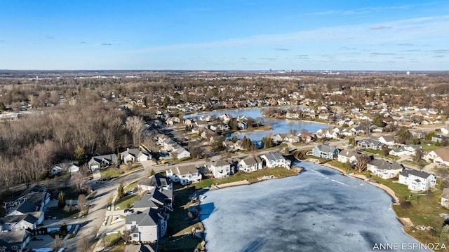 birds eye view of property featuring a water view and a residential view