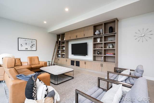 living room with baseboards and recessed lighting