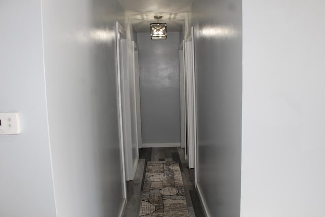 hallway featuring baseboards