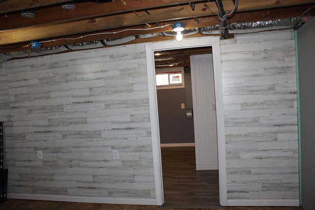 basement with wood finished floors and baseboards