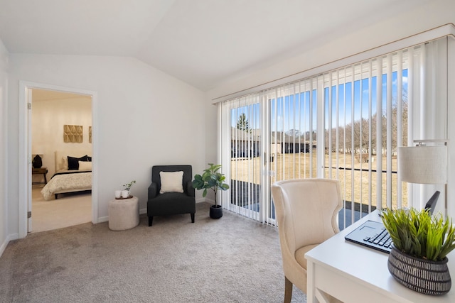 carpeted office featuring baseboards and lofted ceiling