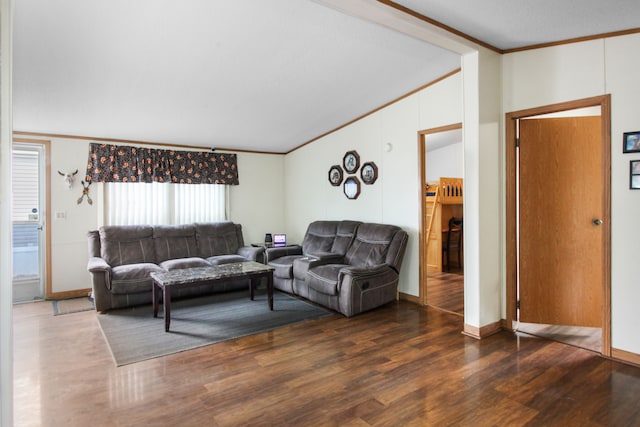 living area featuring baseboards, crown molding, and wood finished floors