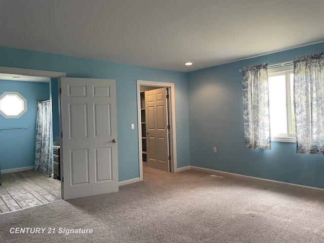 unfurnished bedroom featuring recessed lighting, carpet, and baseboards
