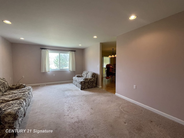 living room with baseboards, carpet flooring, and recessed lighting