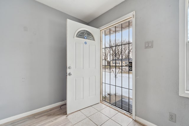 interior space featuring baseboards