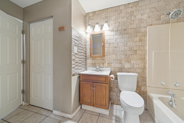 full bathroom featuring shower / tub combination, vanity, toilet, and tile patterned floors