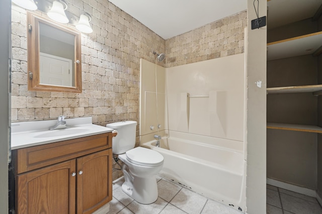 full bathroom featuring toilet, bathtub / shower combination, vanity, and tile patterned floors