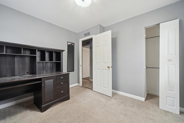 home office featuring light carpet, visible vents, and baseboards