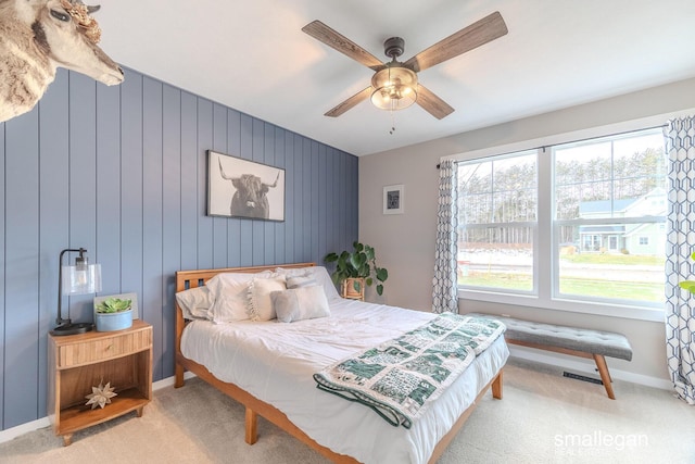 bedroom with carpet, baseboards, and a ceiling fan