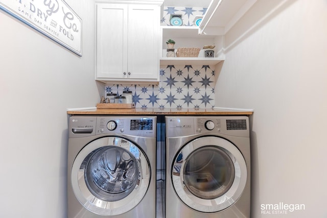 laundry area with cabinet space and washing machine and clothes dryer