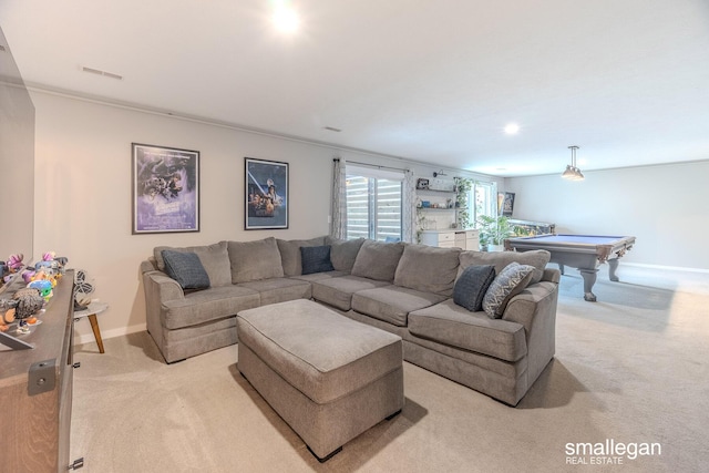 living room featuring baseboards, visible vents, and light colored carpet