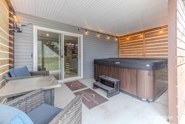 view of patio / terrace with an indoor hot tub