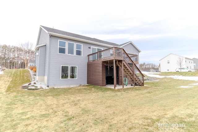 rear view of house featuring a patio area, a lawn, a wooden deck, and stairs