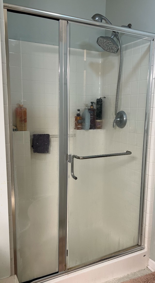 bathroom featuring a shower stall