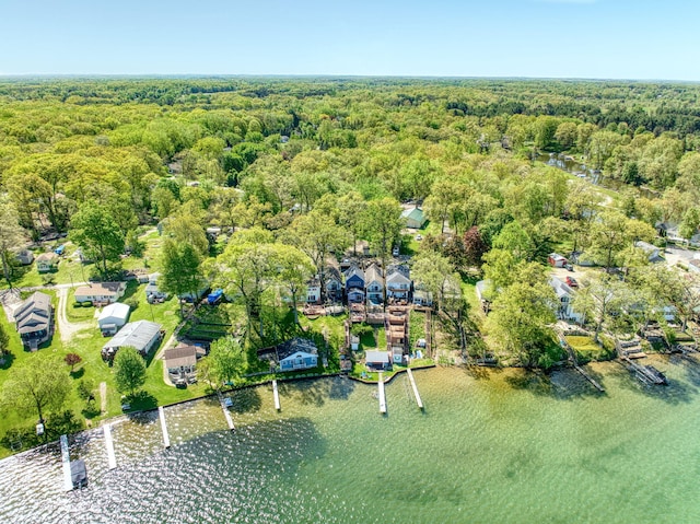 drone / aerial view with a wooded view