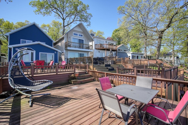 deck featuring outdoor dining area