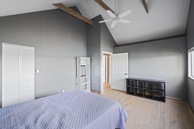 bedroom featuring ceiling fan, high vaulted ceiling, wood finished floors, and beamed ceiling