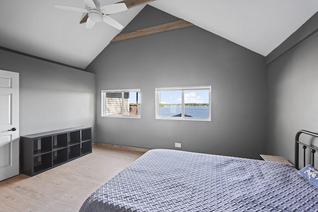 bedroom with high vaulted ceiling, ceiling fan, and wood finished floors