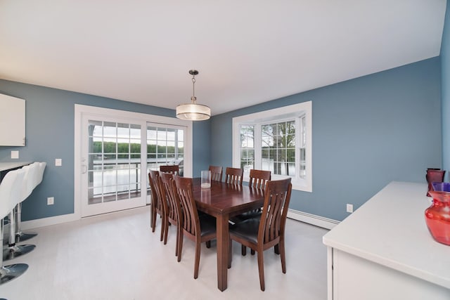 dining room featuring baseboards and baseboard heating