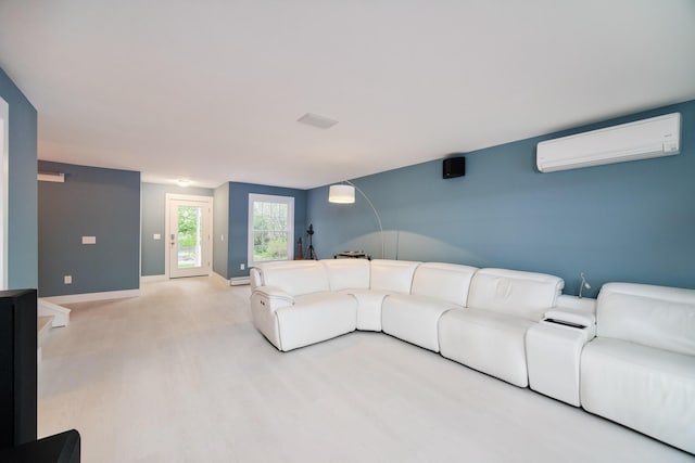 living area with baseboards, an AC wall unit, and wood finished floors