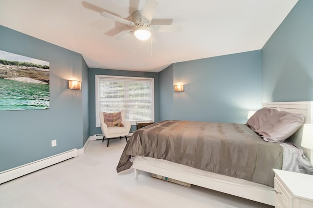 bedroom with baseboards, a baseboard heating unit, and a ceiling fan