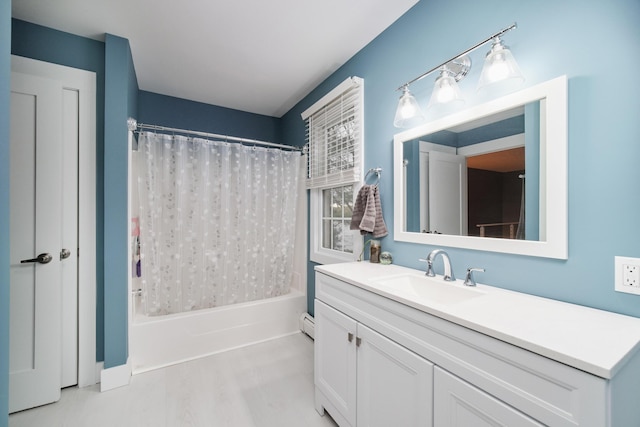 full bath with shower / bath combo, wood finished floors, and vanity