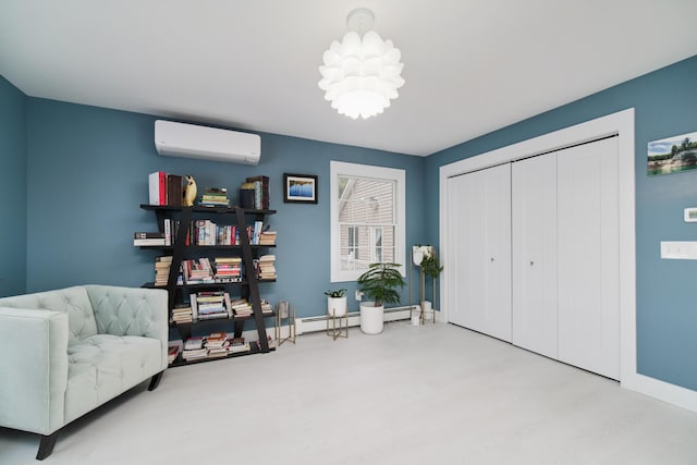 living area with baseboards, an AC wall unit, a baseboard radiator, and a notable chandelier