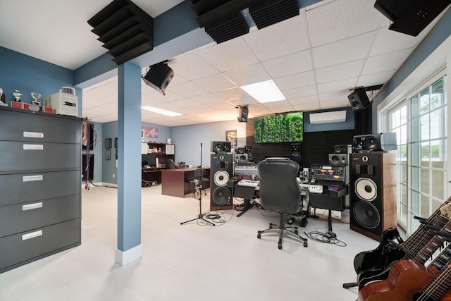 office with a drop ceiling and baseboards