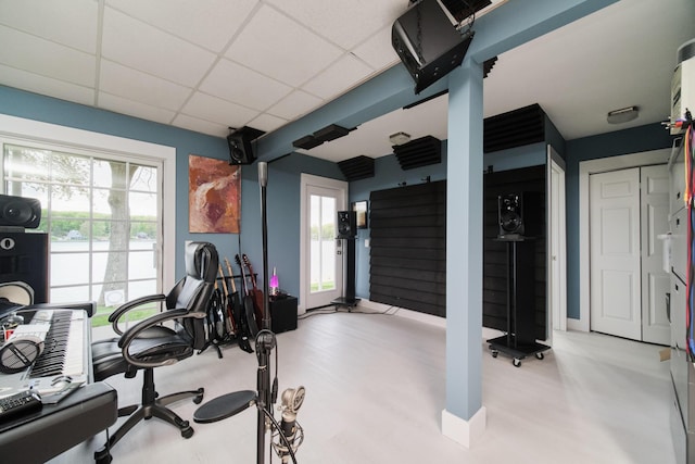 exercise room with a paneled ceiling