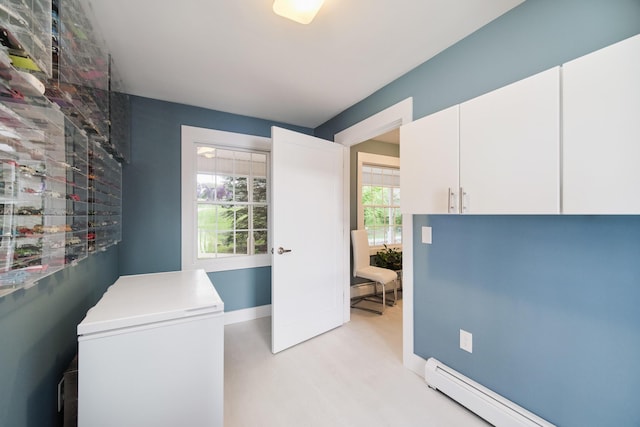 home office with baseboards and a baseboard heating unit