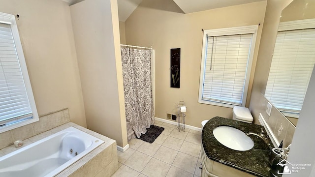 full bath featuring baseboards, visible vents, a tub with jets, tile patterned floors, and vanity