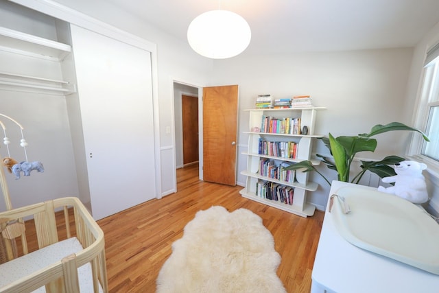 bedroom with a closet and wood finished floors