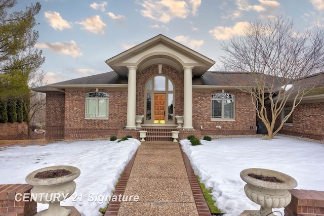 view of front of property featuring french doors and brick siding